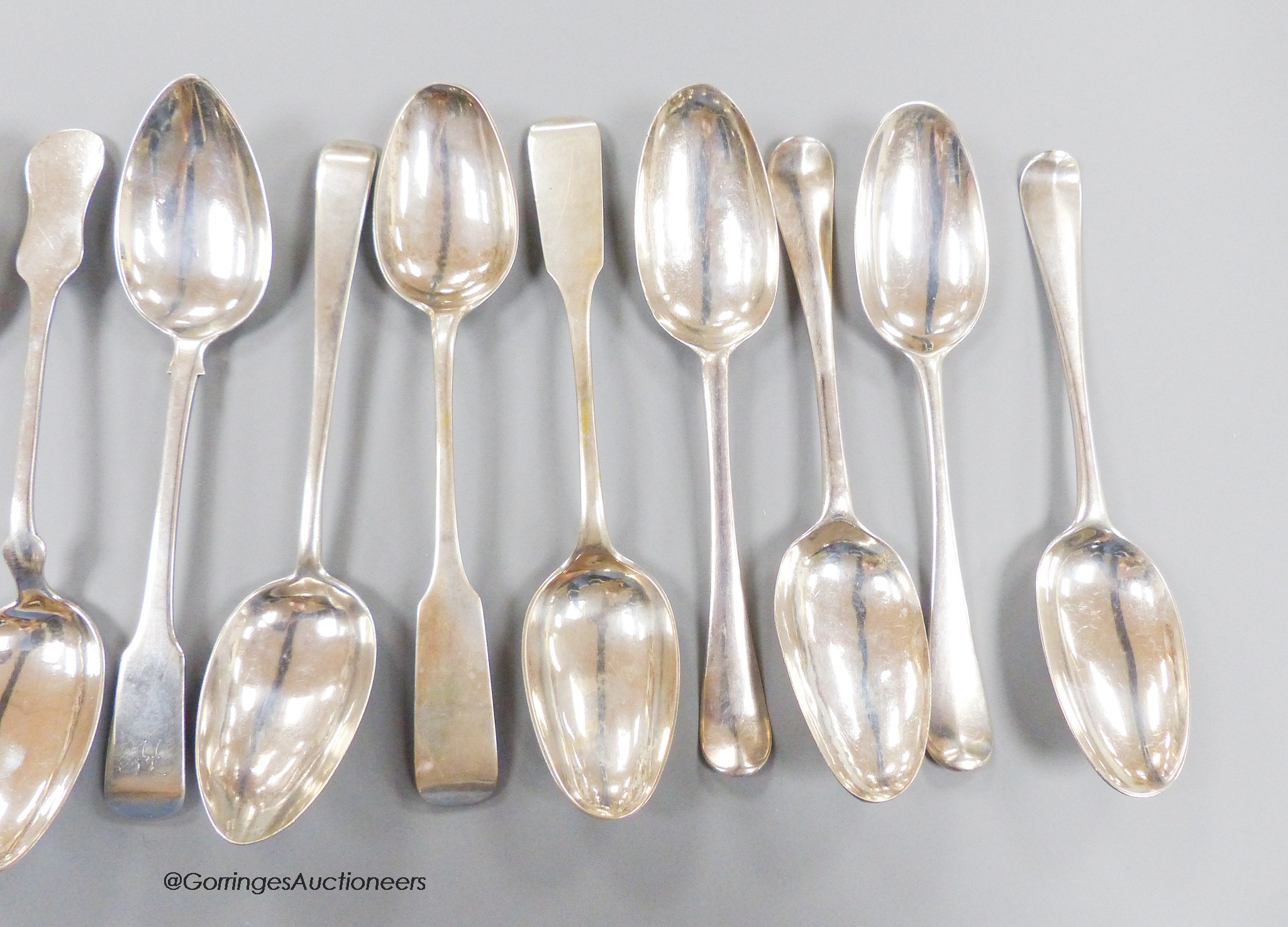 Ten assorted 18th century silver tablespoons and a similar sauce ladle, various pattern, dates and makers and six 19th century continental white metal tablespoons, gross 32.5oz.